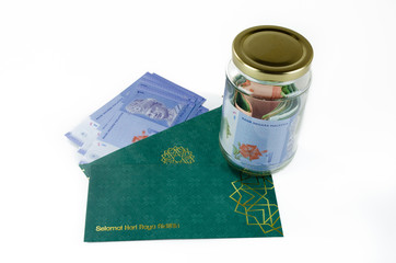 'Duit Raya' is money given from adult to children during Eid al-Fitr celebration in Malaysia. Parents usually take it and save it for children's future (eduction, emergency fund, etc.)
