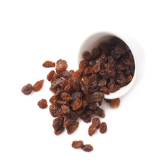 Cup filled with raisins isolated