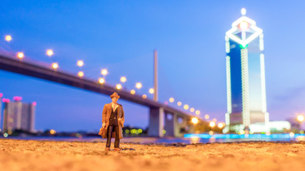 plastic toy standing in front of the river