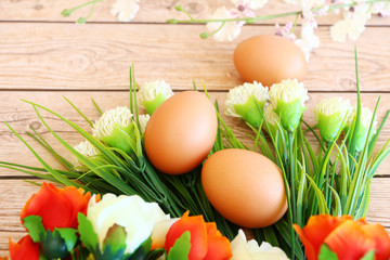 Eggs in the basket on wooden background