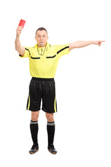 Angry football referee showing a red card
