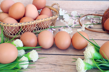 Eggs in the basket on wooden background