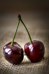 cherries with water drops on jute