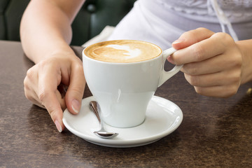 Morning coffee. Cup of Cappuccino in Cafe