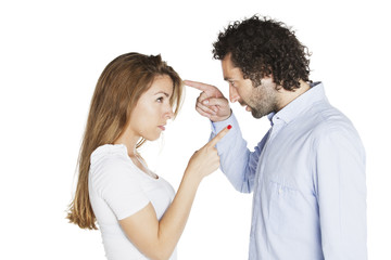 Man and woman pointing each other while arguing