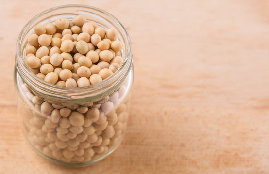 Soy bean in a mason jar on wooden surface