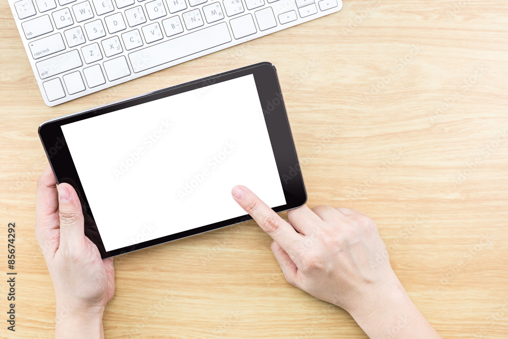 Aufkleber Digital Tablet computer with hand and finger pointing on empty s