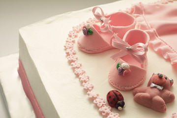Obraz na płótnie Canvas Sugar Shoes on Birthday Cake