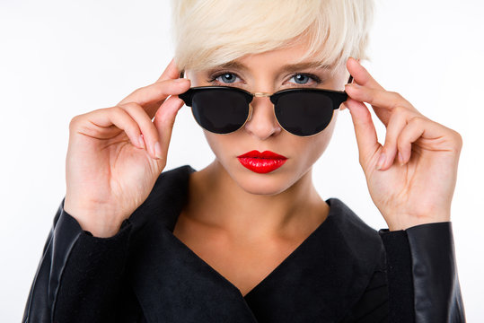 successful beautiful young woman with red lips and sunglasses