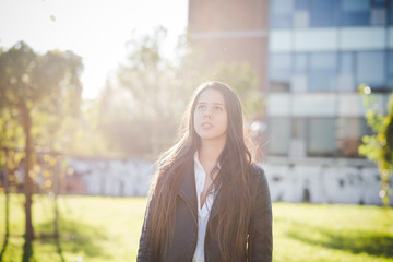 Fototapeta premium young beautiful long hair woman in town