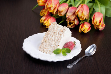 Fototapeta na wymiar Classic Cake Napoleon of puff pastry with custard cream on a pla