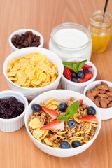 bowl of cornflakes with fresh berries and breakfast cereals