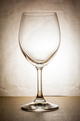Empty wine glass in warm tone