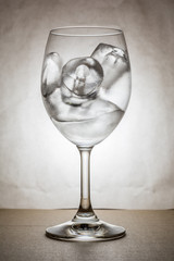 Wine glass with ice in warm tone