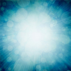 bright white sunburst design on teal blue sunburst pattern background with white bokeh lights, zoomed in effect border