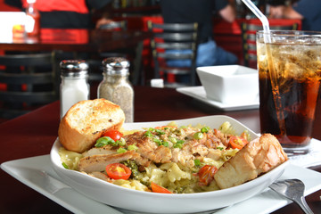 Cajun chicken on bowtie pasta