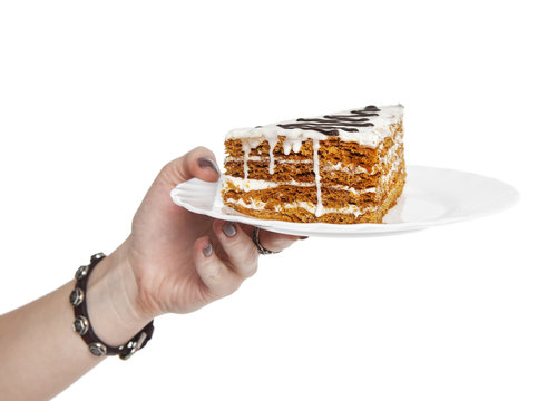 Hand Holding Piece Of Cake Isolated