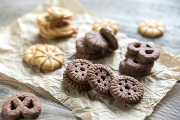 Butter and chocolate chip cookies on the wooden background