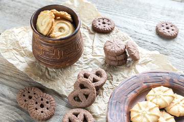 Butter and chocolate chip cookies on the wooden background