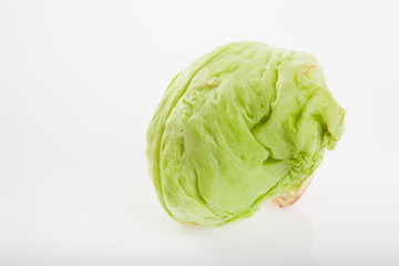 Fototapeta premium Iceberg lettuce on white background
