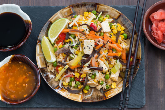 fried rice with tofu and vegetables, top view, close-up