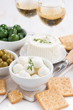 soft cheeses, crackers and pickles for wine, vertical, top view
