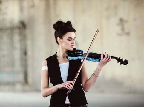 beautiful girl with violin posing