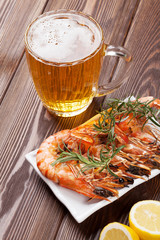 Beer mug and grilled shrimps