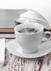 Cup of coffee on a wooden table