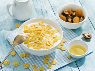 Cornflakes cereal and milk.