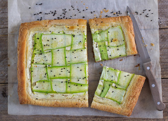 Tart  of puff pastry with  zucchini and goat cheese. Selective F