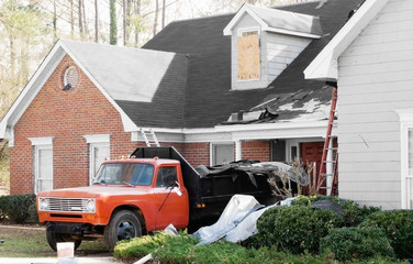 New Roof Installation on a tornado damaged house with truck