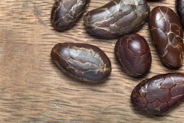 roasted cocoa beans on wooden background