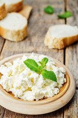 homemade ricotta with bread decorated with mint