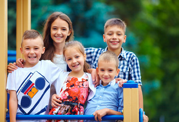 group of happy kids having fun on playground