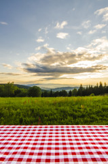 Empty table with landscape background