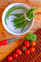 French green beans and tomatoes ready to cut