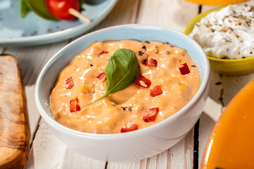 Garnished Mediterranean Dip on Picnic Table