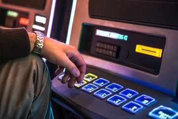 Obraz na płótnie Canvas Men Playing Slot Machine