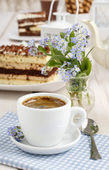 Cup of coffee and tiramisu cake
