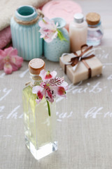 Obraz na płótnie Canvas Bottle of essential oil and spa cosmetics