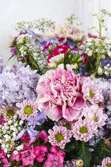Naklejka na ściany i meble Bouquet of carnations, lilacs and chrysanthemums