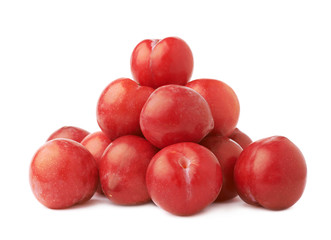 Pile of multiple red plums isolated