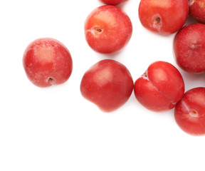 Pile of multiple red plums isolated