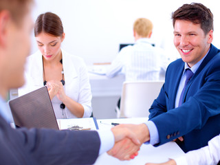 Fototapeta premium Business people shaking hands, finishing up a meeting
