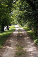 Romantic dusty road in countryside rural scene