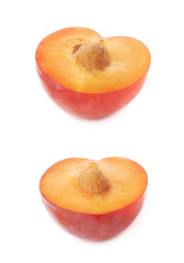 Cut open plum half isolated