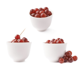 Cup filled with the dark grapes