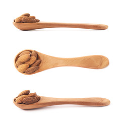 Spoon full of almond seeds isolated