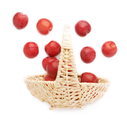 Wicker basked filled with plums